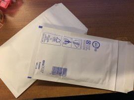 Single cassette padded mailer